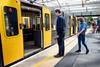 Visually impaired passengers boarding a Tyne & Wear Metro train